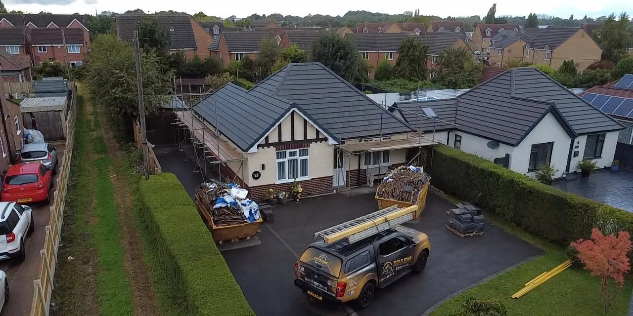 Bungalow re-roofed in grey tiles, seen from the drone