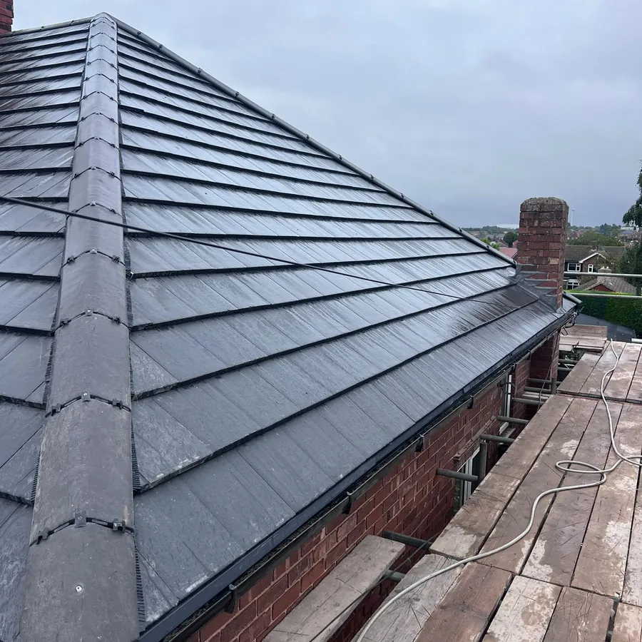 New grey tiles and dry ridge on a hipped bungalow
